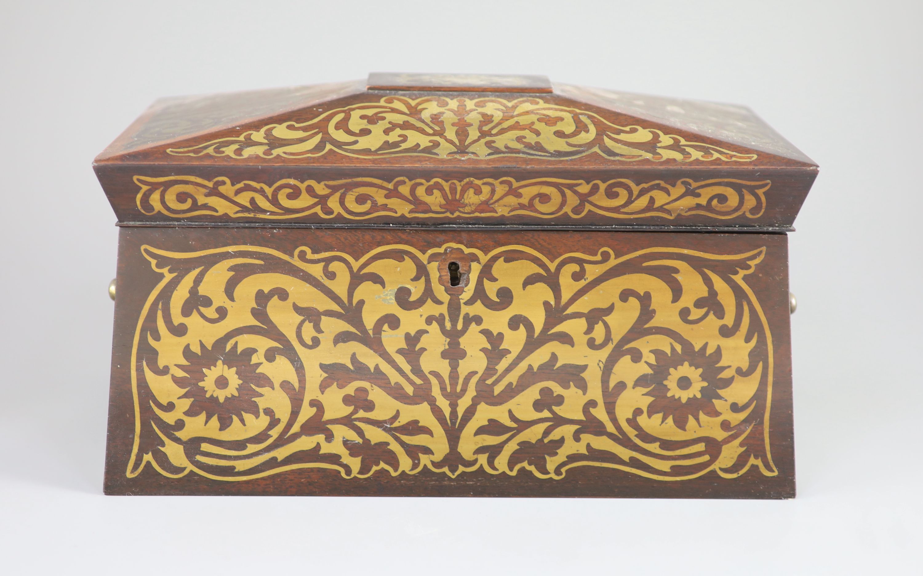 An early 19th century brass inlaid rosewood tea caddy in the boulle manner, 33 x 18cm, 18cm high.